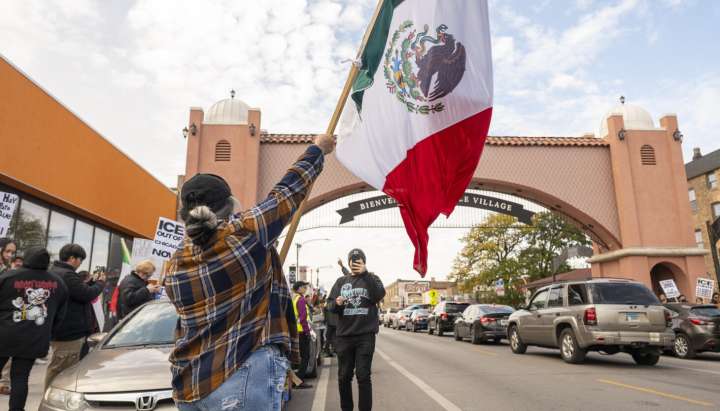 Dozens march through Little Village at anti-ICE protest: 'Being here means supporting my people'