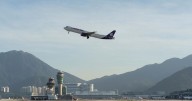 A cargo aircraft skids off a Hong Kong runway into the sea, killing 2 people