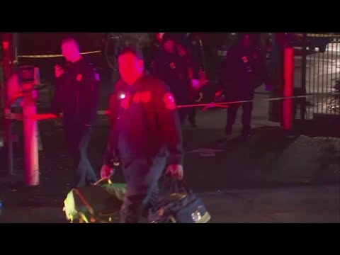 Father charged with murder after son found dead in apartment parking lot following shooting