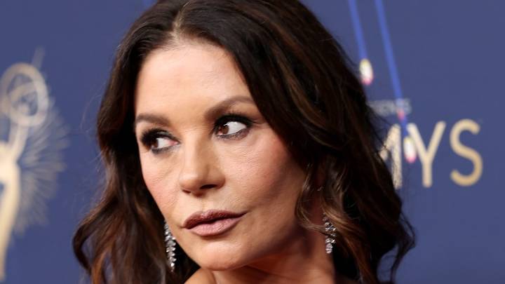 Catherine Zeta Jones, 56, rocks slinky red sequin dress to tease new femme fatale project