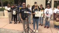 Families of gun violence victims gather at Sen. Rick Scott’s Coral Gables office to demand action