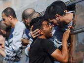 Israel identifies hostage bodies, returns 45 Palestinian dead