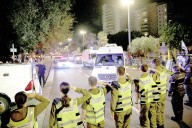 Hamas hands over hostage bodies after Israel threatens aid cut