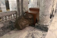 Hammer-wielding intruder sets fire to flag in Washington capitol