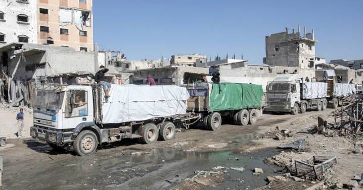 Aid trucks roll into Gaza, Hamas hands over more bodies