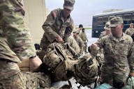 Officials airlift evacuees to safety after the remnants of Typhoon Halong devastate Alaska villages