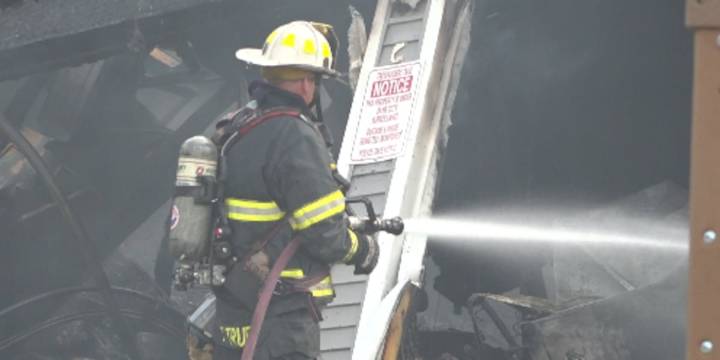Fire destroys Holden garage, home saved