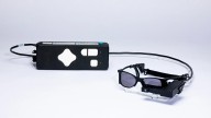 Tiny eye implant, special glasses help some blind patients read