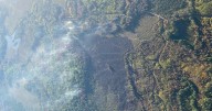 DNR continues to put out hot spots on 100% contained wildfire in Northern Michigan