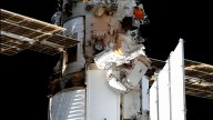 Spacewalking Russian cosmonauts install experiments on the International Space Station