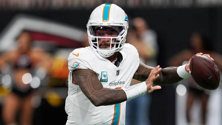Dolphins' Tua Tagovailoa battles illness to throw 4 TDs vs Falcons