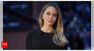 Angelina Jolie shows off back tattoo in backless dress at 'Couture' premiere