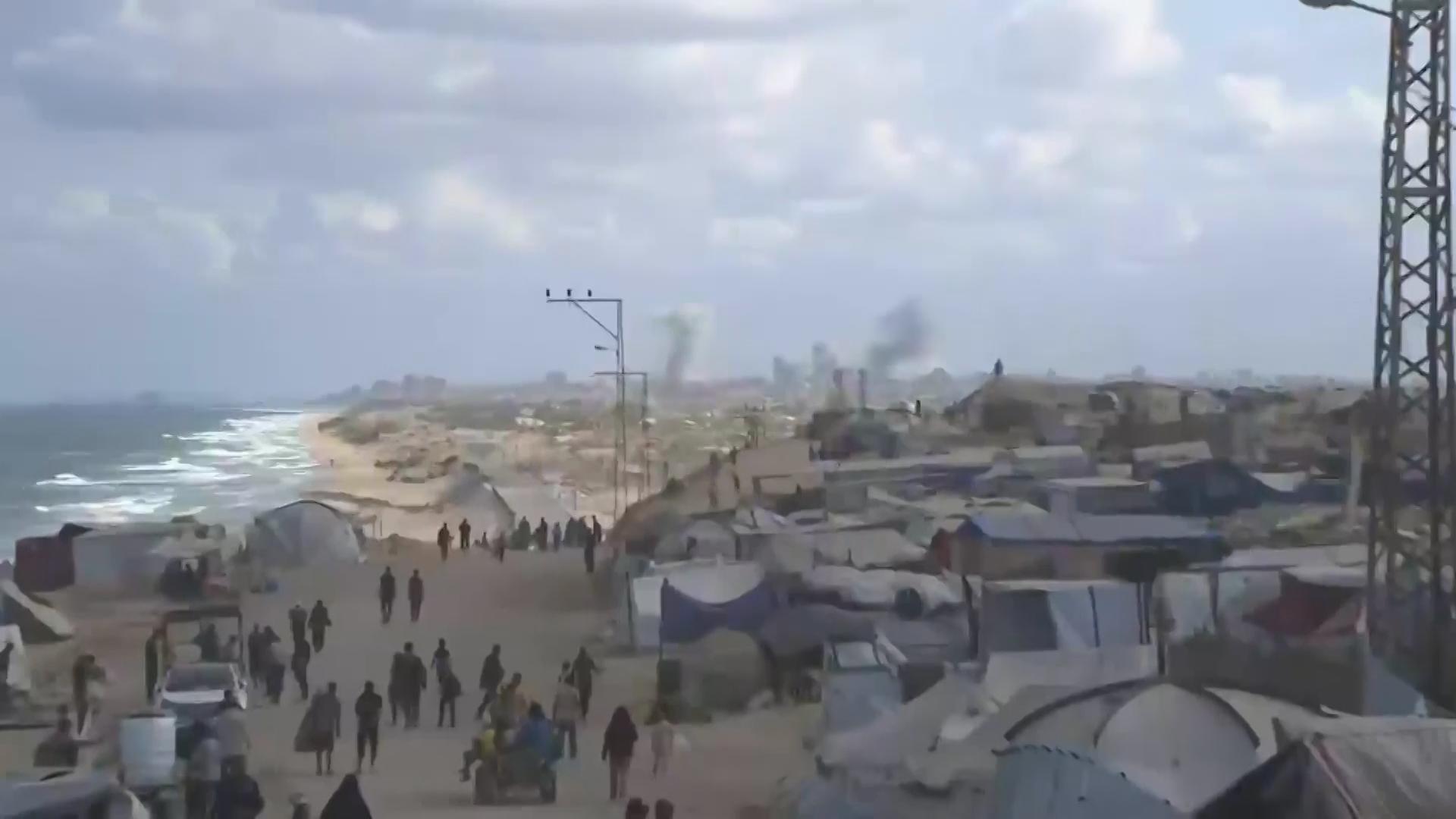 Smoke from explosions over Gaza skyline as Israel and Hamas prepare for talks in Egypt