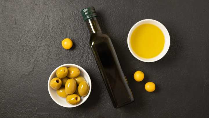 You Should Definitely Be Adding Olive Pits To Your Olive Oil Bottles