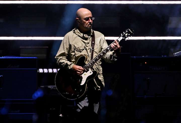 Oasis guitarist takes break from reunion tour for cancer treatment