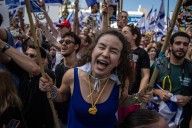 Elation for families of living hostages, while those of deceased decry delay