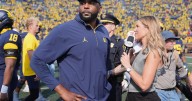 Michigan and coach Moore drop appeal of NCAA penalties from sign