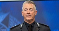 Chief Commissioner Mike Bush: State's top cop apologises for using police helicopter to fly to Tasmania