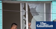 ‘Non-stop bang bang bang’: man arrested after about 50 shots fired from Sydney flat into street, injuring 16