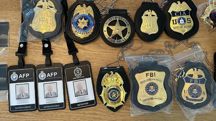 Man, 50, charged after police find fake law enforcement badges and IDs, replica firearms at Double Bay home in Sydney