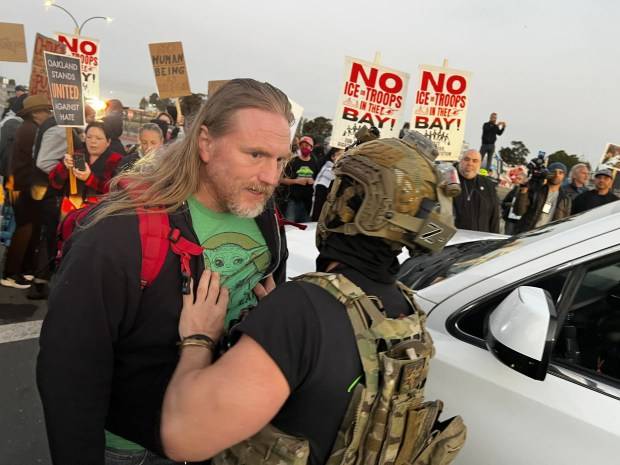 Photos:  Protesters clash with federal agents outside Coast Guard Island as immigration enforcement descends on Bay Area