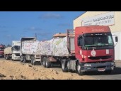 Aid trucks prepare to enter Gaza as Israel says ceasefire is in effect