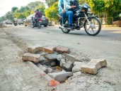 Potholes, open manholes turn into death traps on city roads