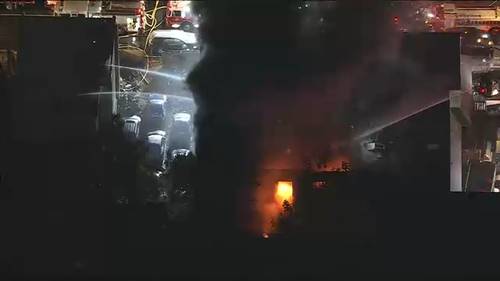 Philadelphia firefighters battle heavy flames on Meadow Street in Frankford