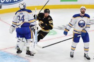 Bruins hold off Sabres to remain perfect through three games