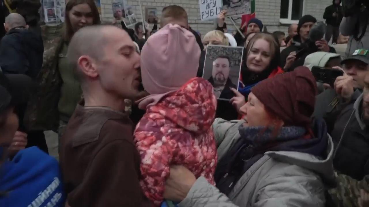 Ukrainian soldiers greeted by their families in Ukraine after prisoner swap with Russia