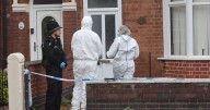 Girl and boy found dead in house named as woman arrested on suspicion of murder
