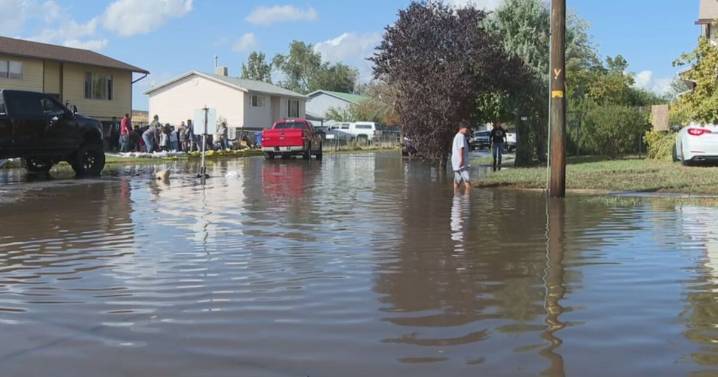 Residents come together to help clean up after damaging floods in Salt Lake