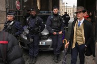 Inspector Clouseau? The mystery man in an AP photo after the Louvre jewel heist creates a buzz