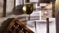 Gabriela Eisenhart’s golden-hour grouping of patinated brass, warm beige weaves and vintage carved wood