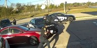 Officer thrown onto hood of car by suspect who soon crashed into lake, police say