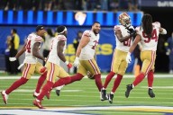 Short-handed 49ers stop Rams on downs in overtime, preserving a 26