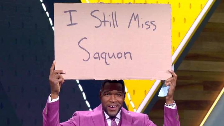 Desperate Michael Strahan holds up sign during Fox NFL Sunday as Giants icon is told