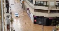 Massive floods rip through Spanish streets with cars swept away and trains cancelled