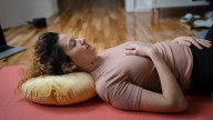 If you experience an achy neck, a yoga instructor says these three moves can help ease discomfort and correct your posture