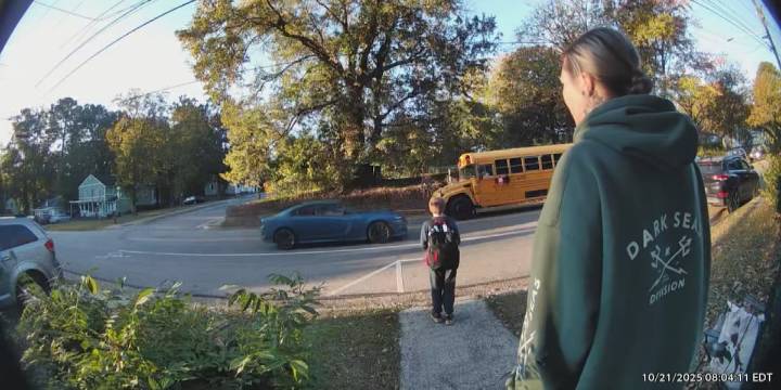 Doorbell video captures driver illegally passing stopped school bus in Greenville