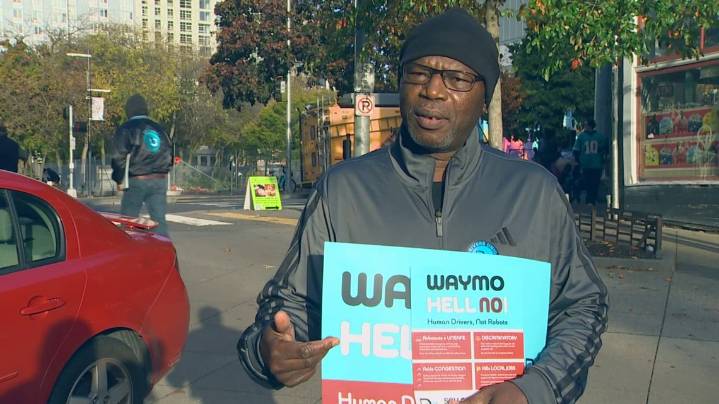 'Hell no, Waymo': Seattle rideshare drivers, union advocates rally against driverless taxi service