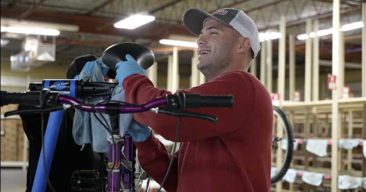 KMTV team helps clean bikes for kids ahead of the holidays