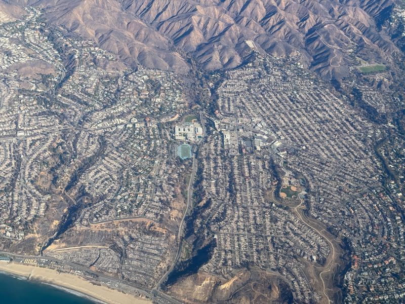 Man arrested as suspect in setting California's deadly Palisades Fire, official says