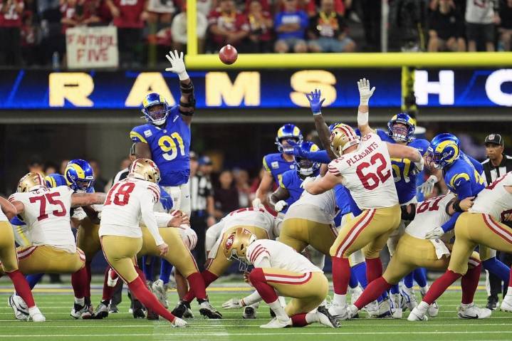 Short-handed 49ers stop Rams on downs in overtime, preserving a 26