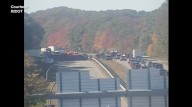 East Greenwich tractor trailer rollover crash spills gravel on highway, five drivers treated for injuries