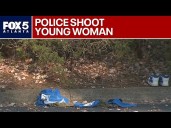 Young woman shot by officers, man in custody