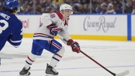 Canadiens’ Calder Trophy winner Lane Hutson signs long