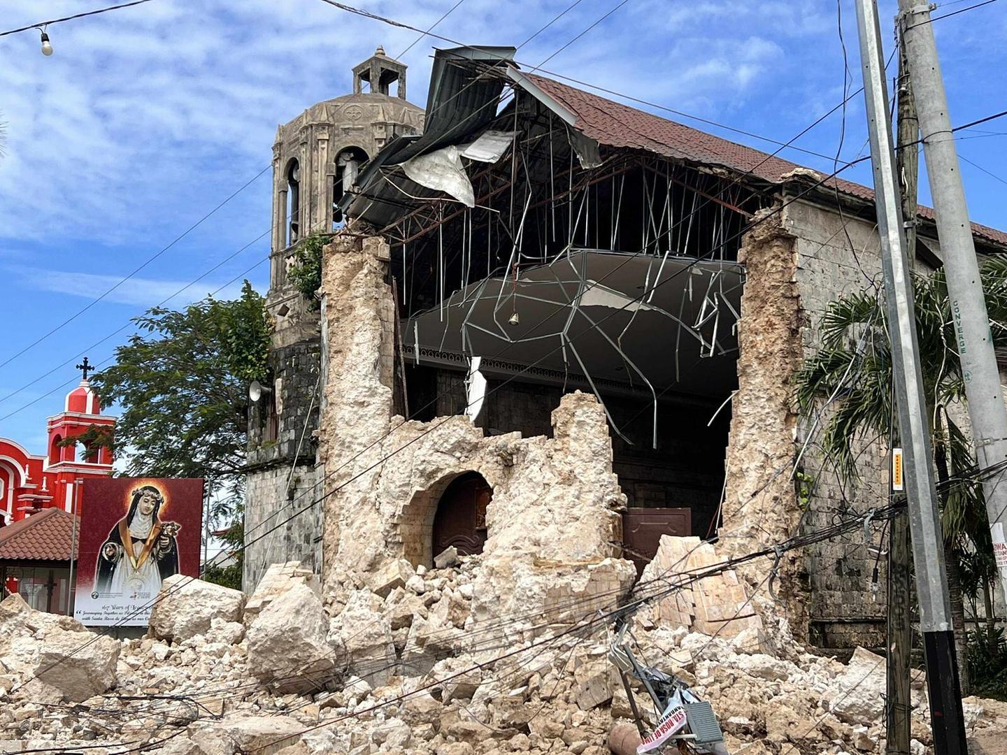 Extensive damage from powerful earthquake that hit the Philippines and killed at least 69