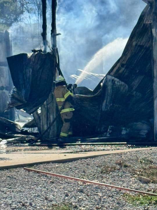 Shop destroyed after catching fire from nearby burn barrel