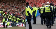 Scottish football fans call for police to be cut at matches after £9m bill revealed by Record
